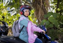 How AI and Tech Skills Are Opening New Career Paths for Women in Southeast Asia – A Microsoft Perspective Woman wearing helmet riding a motorbike.