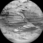 Curiosity Blog, Sols 4575-4576: Ideal Spot Found by NASA Science A grayscale, closeup image of Martian terrain, showing three areas of layered rocks, which are textured in a way that looks like reptile skin.