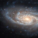 NASA’s Hubble Captures Stunning Spiral Galaxy Image NASA Logo