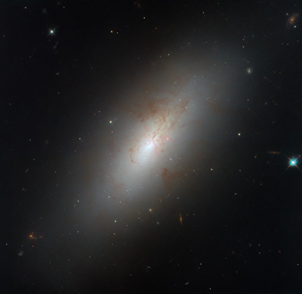 hubble ngc4694 potw2440a.jpg NASA Logo