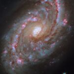 NASA’s Hubble Observes Majestic Spiral Galaxy with Starbursts NASA Logo
