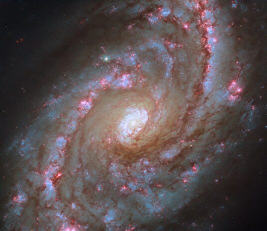 NASA’s Hubble Observes Majestic Spiral Galaxy with Starbursts NASA Logo