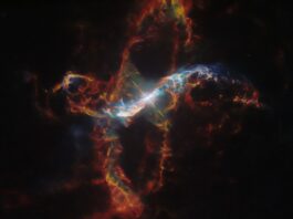 Hubble Captures Image of a Star Erupting Like Volcano NASA Logo