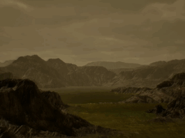 NASA Study Reveals Protocell Development Path on Titan A mountainous formation on Titan with a lake and cloudy atmosphere.