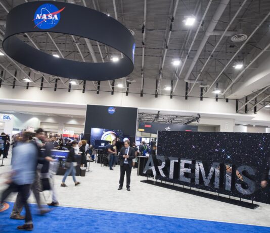 NASA Showcases Space Innovation at Exploration Conference Attendees are seen by the NASA exhibit at the 70th International Astronautical Congress, Friday, Oct. 25, 2019, at the Walter E. Washington Convention Center in Washington.