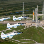 NASA Johnson’s Visual Legacy: Art and Analysis Unite Collaboratively Four NASA T-38 Talon jets fly in formation over Kennedy Space Center.