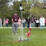 Artemis ROADS III Competitors Celebrate Success in NASA Challenge A water bottle rocket takes off in front of a crowd.