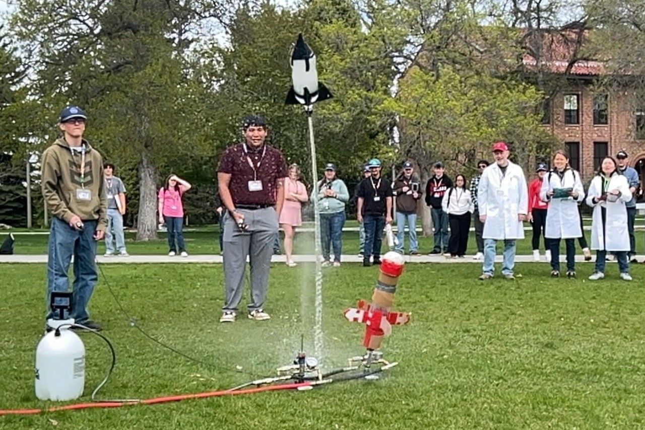 image 5 low res darci snowden.jpg A water bottle rocket takes off in front of a crowd.