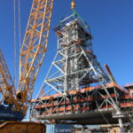 NASA Prepares Artemis II Hardware at Kennedy Space Center Teams at Bechtel National, Inc. use a crane to lift Module 4 into place atop the mobile launcher 2 tower chair at its Kennedy Space Center park site on January 3, 2025. Module 4 is the first of seven modules that will be stacked vertically to make up the almost 400-foot launch tower that will be used beginning with the Artemis IV mission.