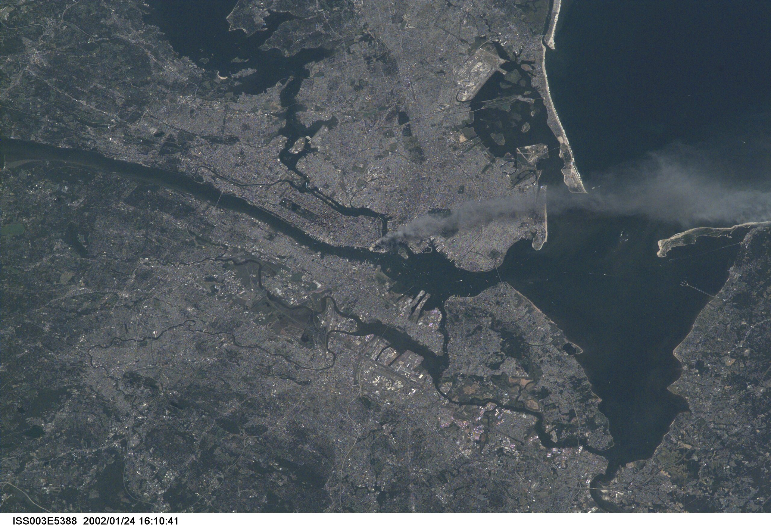 iss003e5388 9504788546 o.jpg One of a series of pictures taken of metropolitan New York City (and other parts of New York as well as New Jersey) by one of the Expedition Three crew members onboard the International Space Station (ISS) at various times during the day of September 11, 2001. The image shows a smoke plume rising from the Manhattan area. The orbital outpost was flying at an altitude of approximately 250 miles. The image was recorded with a digital still camera. Please note: The date identifiers on some frames (other than those that indicate Sept. 11, 2001) are not accurate due to a technical problem with one of the Expedition Three cameras.