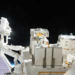 NASA Highlights: Top Station Science News for March 7, 2025 A view of an exposed module outside the International Space Station with solar panels and the darkness of space behind it.