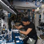 NASA Launches Space Experiment on Antibiotic-Resistant Bacteria Astronaut Jeanette Epps is shown squeezing a pipette into bacteria samples onboard the International Space Station.