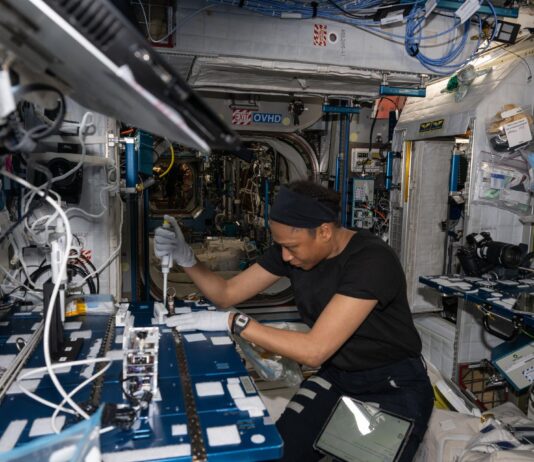 NASA Launches Space Experiment on Antibiotic-Resistant Bacteria Astronaut Jeanette Epps is shown squeezing a pipette into bacteria samples onboard the International Space Station.