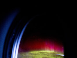 NASA Observes Red and Green Aurora Sweeping Earth’s Atmosphere iss072e031823 (Oct. 7, 2024) -- Peering through the window of the SpaceX Dragon Endeavour spacecraft, NASA astronaut Matthew Dominick captured this image of the SpaceX Dragon Freedom spacecraft as vivid green and pink aurora swirled through Earth