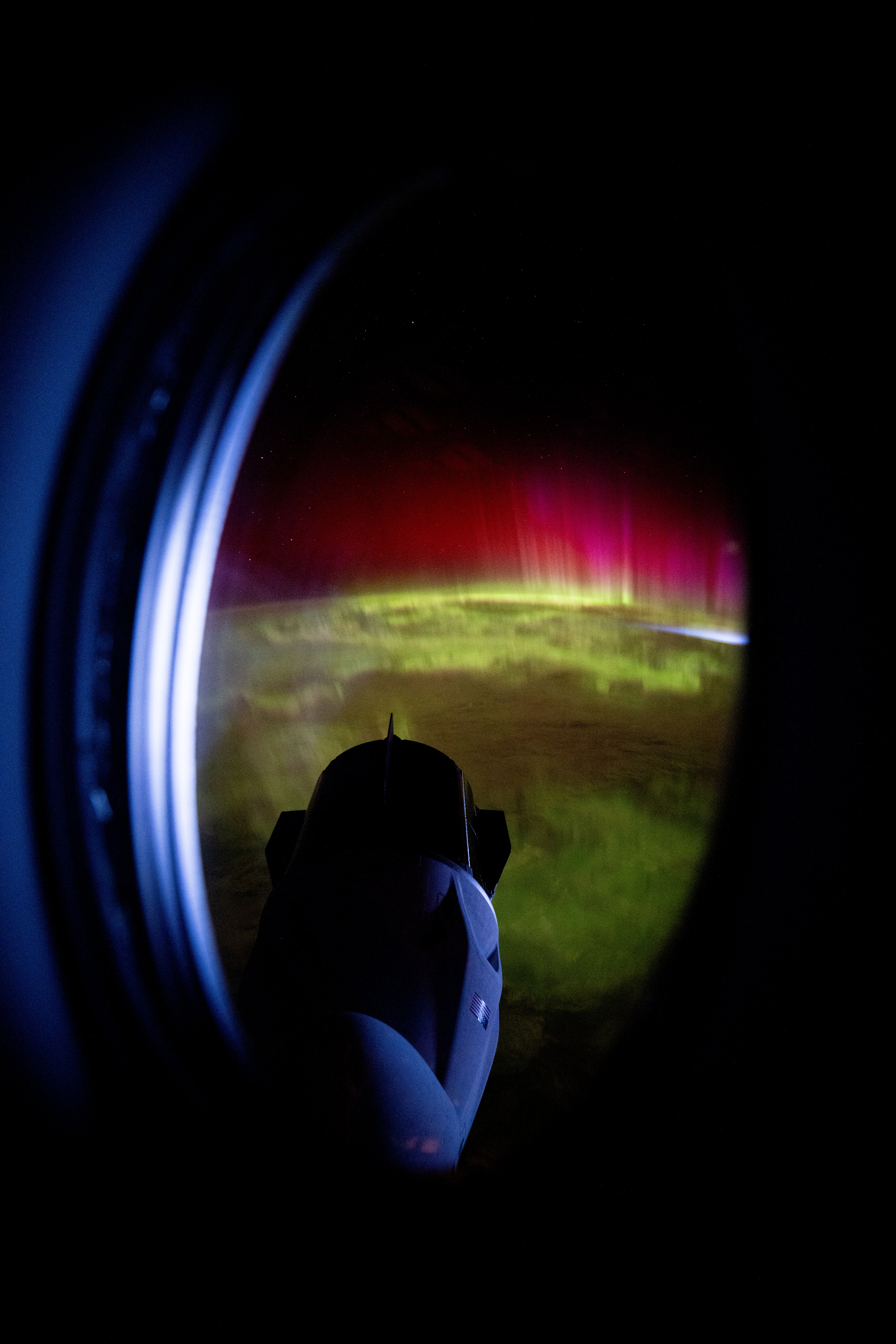 iss072e031823.jpg iss072e031823 (Oct. 7, 2024) -- Peering through the window of the SpaceX Dragon Endeavour spacecraft, NASA astronaut Matthew Dominick captured this image of the SpaceX Dragon Freedom spacecraft as vivid green and pink aurora swirled through Earth