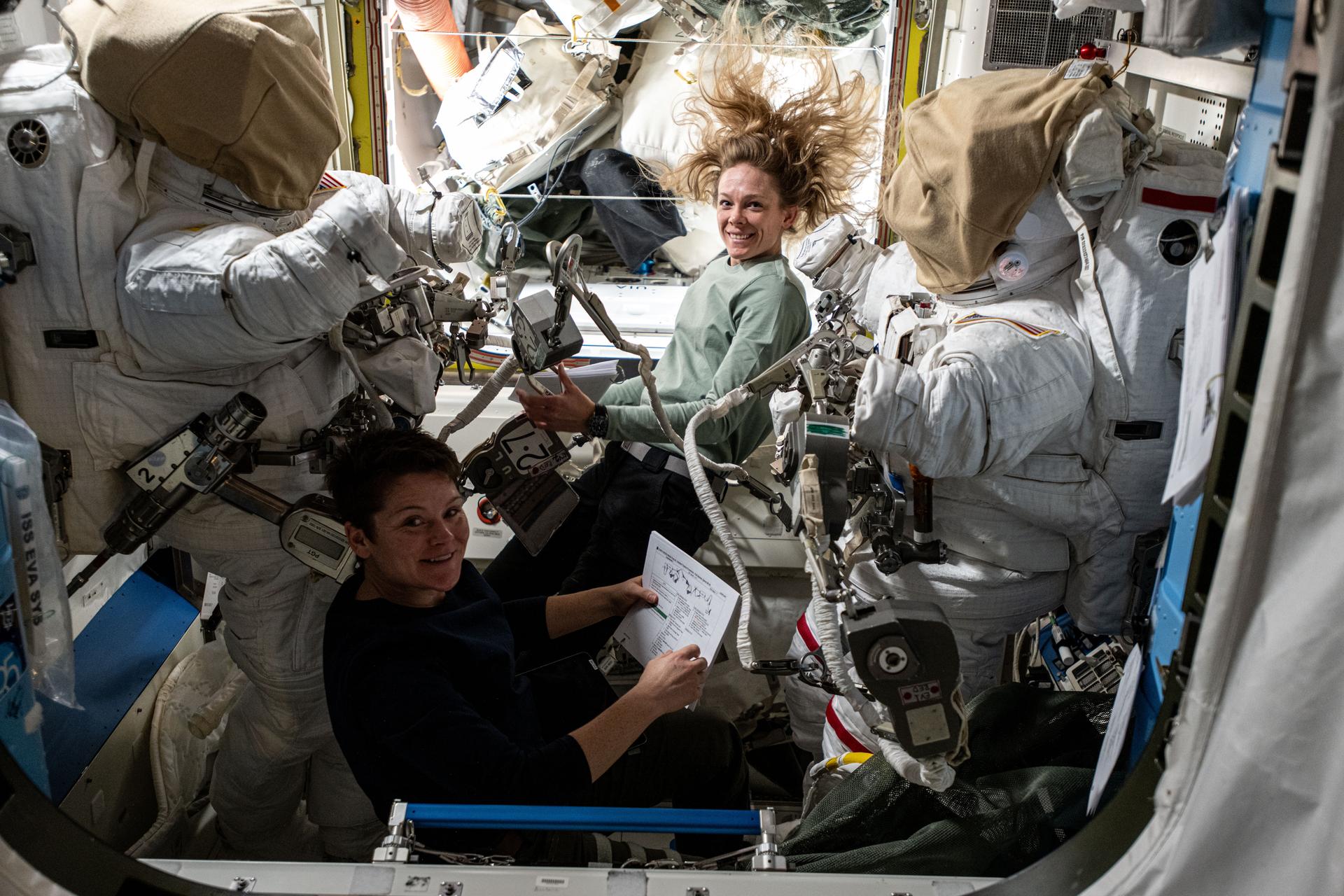 iss073e0000415large.jpg NASA astronauts Anne McClain (bottom) and Nichole Ayers (top), both Expedition 73 Flight Engineers, checkout spacesuit hardware in the Quest airlock and review procedures for a May 1 spacewalk.