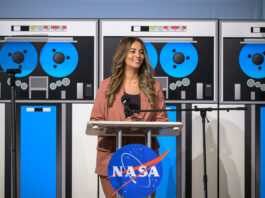Nilufar Ramji: Propelling Johnson’s Major Advances at NASA A woman dressed in a light brown suit smiles and stands at a podium during an event.