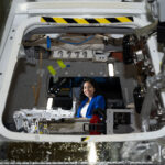 NASA Engineer Zaida HernandezNASA’s renowned team of engineers has a standout member who has recently caught the attention of both the scientific community and the public: Zaida Hernandez. Known for her exceptional skills and innovative contributions, Zaida’s journey to NASA and her ongoing projects offer a fascinating look into the cutting-edge world of space exploration.Early Life and EducationZaida Hernandez’s path to becoming a NASA engineer is a tale of determination, hard work, and an unwavering passion for science and technology. Growing up in a modest environment, Zaida was always fascinated by the stars and the mechanics of how things work. This curiosity led her to pursue a degree in Aerospace Engineering, where she excelled and quickly became known for her problem-solving abilities and innovative thinking.Career at NASAZaida joined NASA several years ago, and her impact has been profound. Her role involves working on various key projects that are critical to NASA’s mission of space exploration and technological advancement. One of her notable contributions includes her work on the Mars Rover program, where she played a pivotal role in designing and testing components that ensure the rover’s functionality in the harsh conditions of Mars.Significant ContributionsMars Rover Project: Zaida’s engineering expertise was crucial in developing the rover’s navigation system, which allows it to traverse the Martian terrain autonomously. Her work ensured that the rover could avoid obstacles and collect high-quality data, significantly advancing our understanding of the Red Planet.Satellite Development: Another significant area where Zaida has made substantial contributions is satellite technology. She has been involved in designing satellites that monitor climate change, providing critical data that helps scientists understand and address global environmental challenges.Spacecraft Innovation: Zaida’s innovative approach has led to the development of new materials and technologies that improve the durability and efficiency of spacecraft. Her work ensures that these crafts can withstand the extreme conditions of space travel, thus pushing the boundaries of what is possible in space exploration.Challenges and TriumphsZaida’s journey has not been without its challenges. As a woman in a predominantly male field, she has faced numerous obstacles. However, her resilience and dedication have helped her overcome these barriers and achieve remarkable success. Her story is not just one of personal triumph but also serves as an inspiration to young aspiring engineers, particularly women and minorities, who dream of a career in STEM (Science, Technology, Engineering, and Mathematics).Impact and RecognitionZaida Hernandez has received several accolades for her contributions to engineering and space exploration. Her work has been published in numerous scientific journals, and she is frequently invited to speak at conferences and symposiums around the world. Her contributions have not only advanced NASA’s mission but have also paved the way for future innovations in space technology.Looking AheadLooking forward, Zaida continues to work on groundbreaking projects that have the potential to revolutionize space exploration. She is currently involved in developing next-generation propulsion systems that could significantly reduce the time it takes to travel to distant planets. Her vision includes making space travel more accessible and sustainable, which could one day lead to human colonization of other planets.Good to KnowFor those interested in following in Zaida’s footsteps, there are several pathways to a career in aerospace engineering. A strong foundation in mathematics and physics is essential, as well as a willingness to continuously learn and adapt to new technologies. Internships and networking with professionals in the field can also provide valuable experience and open up opportunities for aspiring engineers.Reaction to Zaida’s AchievementsZaida Hernandez’s achievements have been met with widespread admiration and respect within the scientific community. Colleagues praise her for her technical expertise, innovative mindset, and leadership qualities. Her journey is a testament to what can be achieved with passion, dedication, and a commitment to pushing the boundaries of human knowledge.In conclusion, Zaida Hernandez stands as a beacon of inspiration in the field of aerospace engineering. Her contributions to NASA and her ongoing efforts to advance space technology highlight the incredible impact one individual can have on the future of space exploration. For more detailed information on her projects and career, you can visit NASA’s official website.
Zaida Hernandez, a hispanic woman with long wavy brown hair and dark brown eyes, smiles brightly at the camera while sitting inside a mock up of NASA