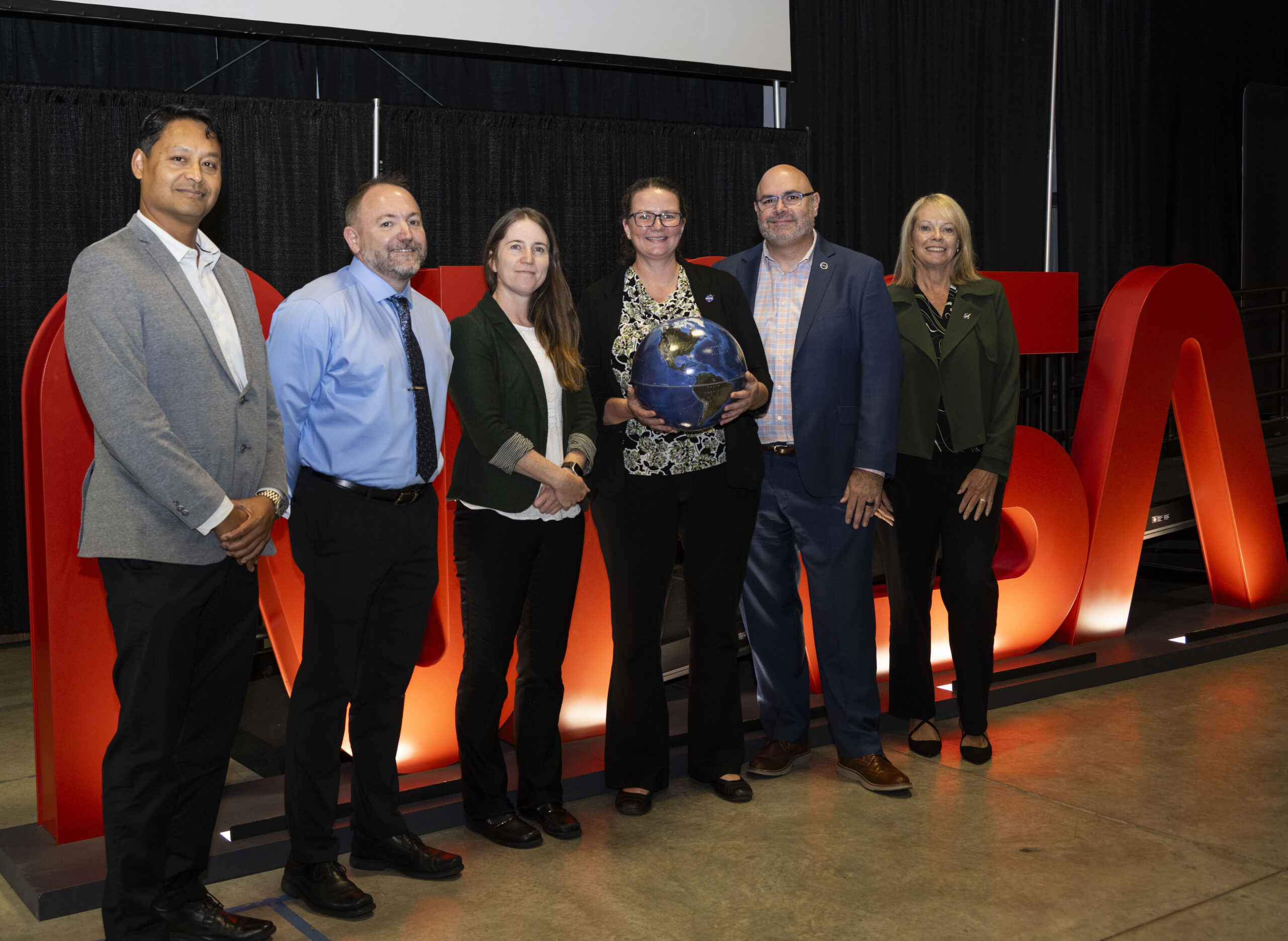 kam 1909.jpg NASA Chief Scientist and Senior Climate Advisor Kate Calvin, center left, joins team members at the agency’s Marshall Space Flight Center for a Climate and Science Town Hall on Sept. 17 in Activities Building 4316. Calvin took part in a question-and-answer session during her visit that was live streamed agencywide. Joining her in the session were, from left, Rahul Ramachandran, research scientist and senior data science strategist for the Science Research and Project Division at Marshall; Marshall Earth Science Branch Chief Andrew Molthan; Marshall Chief Scientist Renee Weber; Marshall Center Director Joseph Pelfrey; and Marshall Science and Technology Office Manager Julie Bassler, who moderated the panel.