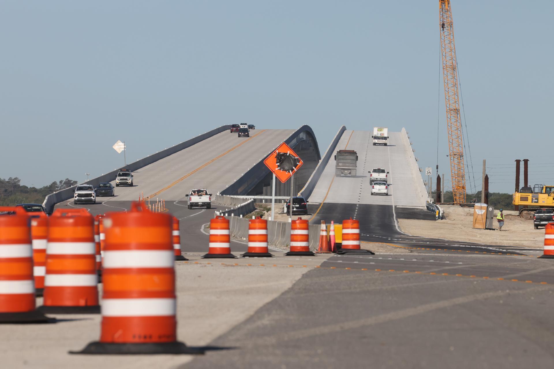 ksc 20250319 ph geb01 0026large.jpg Image shows cars driving on a recently opened road that was under construction