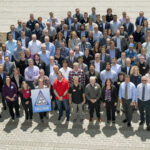 NASA’s Spring 2025 Review: High-Rate Composite Aircraft Project A large group of people who work on composite aircraft pose outside in a parking lot.
