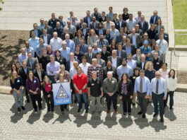 NASA’s Spring 2025 Review: High-Rate Composite Aircraft Project A large group of people who work on composite aircraft pose outside in a parking lot.