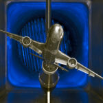 NASA’s Innovative Tools and Technologies for Transformational Resources A scale model of a silver jet airliner with two engines is tested in a wind tunnel, part of the TTT available resources.