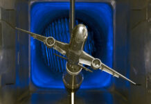 NASA’s Innovative Tools and Technologies for Transformational Resources A scale model of a silver jet airliner with two engines is tested in a wind tunnel, part of the TTT available resources.