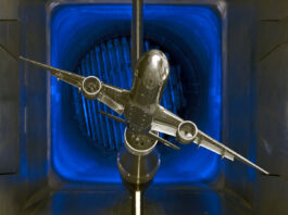 NASA’s Innovative Tools and Technologies for Transformational Resources A scale model of a silver jet airliner with two engines is tested in a wind tunnel, part of the TTT available resources.