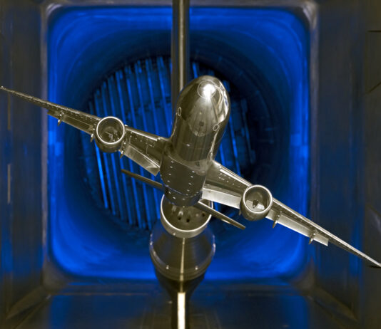 NASA’s Innovative Tools and Technologies for Transformational Resources A scale model of a silver jet airliner with two engines is tested in a wind tunnel, part of the TTT available resources.