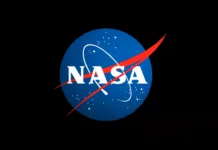 NASA Executives to Join 2025 Space Symposium in Colorado The letters NASA on a blue circle with red and white detail, all surrounded by a black background