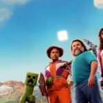 Minecraft Film Released Today The official poster for A MINECRAFT MOVIE. A sunny scene from the Overworld features protagonists Dawn, Steve, Garrett, Henry, Natalie standing next to each other facing the camera. To their left, there is a creeper, and in the foreground we see Dennis, Steve’s pet wolf. An Overworld landscape is visible behind the characters.