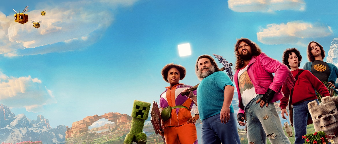 mncrft main mojang 1170x500 textless.jpg The official poster for A MINECRAFT MOVIE. A sunny scene from the Overworld features protagonists Dawn, Steve, Garrett, Henry, Natalie standing next to each other facing the camera. To their left, there is a creeper, and in the foreground we see Dennis, Steve’s pet wolf. An Overworld landscape is visible behind the characters.