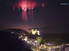 h3 tag: NASA Captures Sprites Above Château de Beynac Red streaks branch out high in the sky above a city lit up at night.