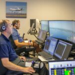 NASA Offers Software Solutions Directly to Innovators Andy Burroughs (left) and Paul Friz in the roles of air taxi pilots running through air taxi integration simulations focusing on urban air space at NASA’s Langley Research in Hampton, Virginia on Sept. 25, 2024.