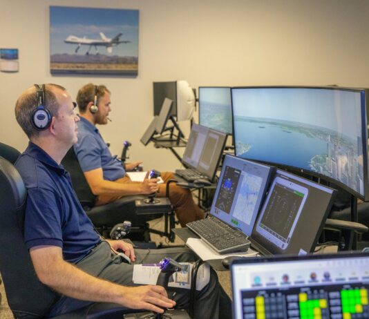 NASA Offers Software Solutions Directly to Innovators Andy Burroughs (left) and Paul Friz in the roles of air taxi pilots running through air taxi integration simulations focusing on urban air space at NASA’s Langley Research in Hampton, Virginia on Sept. 25, 2024.