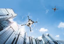 Charting Flight Paths for Drones in Controlled Airspace Autonomous vehicle drones in flight among city buildings.