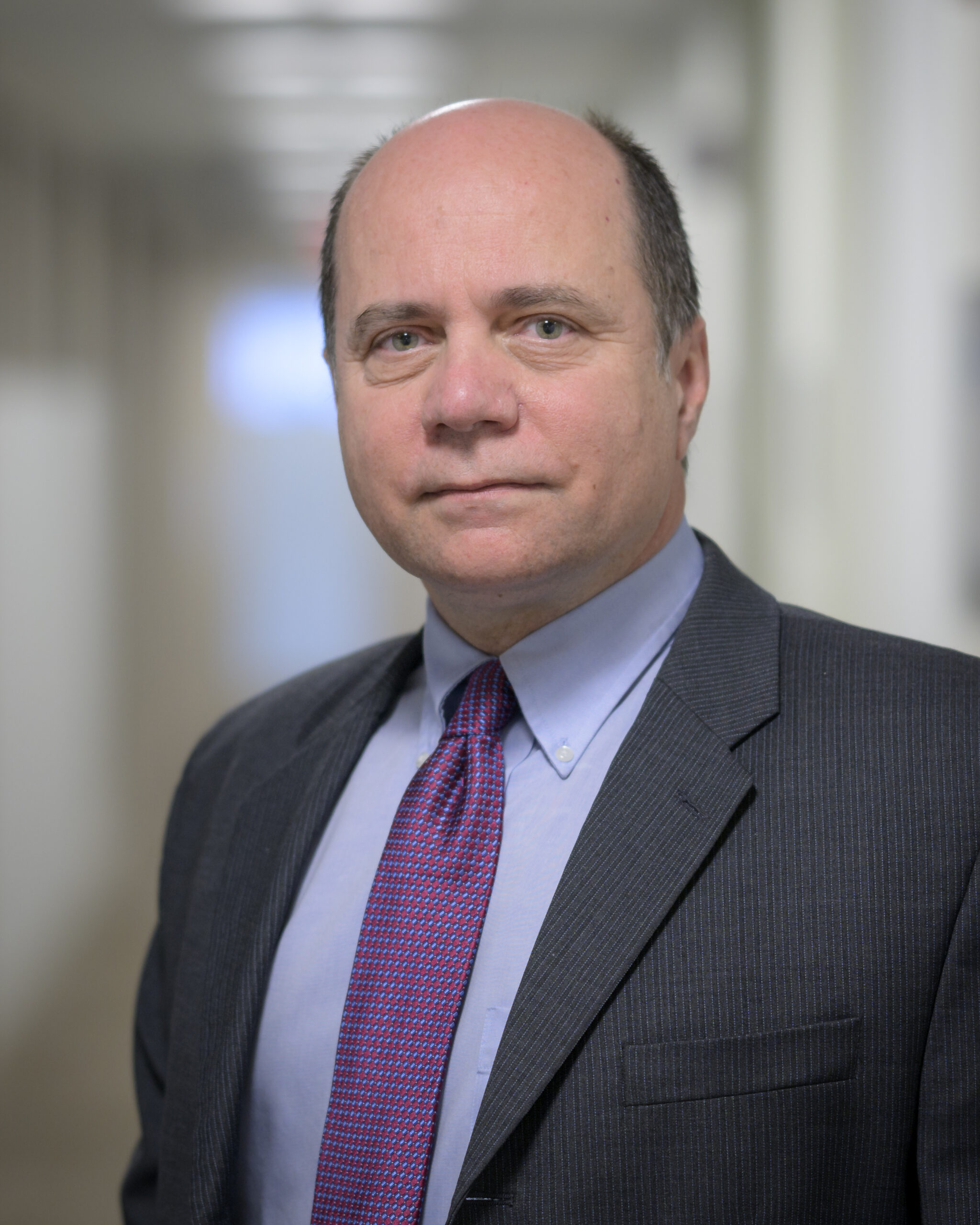 nhq202201270024.jpeg A white man with grey hair on the sides of his head. He