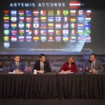 Latvia Joins NASA’s Artemis Accords as Newest Signatory Dace Melbārde, Latvia’s Minister for Education and Science, second from right, signs the Artemis Accords, as NASA Administrator Jared Isaacman, second from left, Jacob Helberg, U.S. Under Secretary of State for Economic Affairs, left, and Jānis Beķeris, Chargé D’Affaires a.i. at the Embassy of the Republic of Latvia to the United States, right, look on Monday, April 20, 2026, at the Mary W. Jackson NASA Headquarters building in Washington. The Artemis Accords graphic of all signatory flags is behind them.
