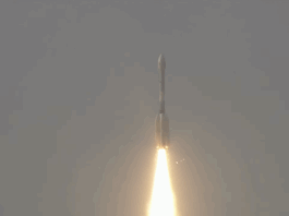 NASA-ISRO Satellite Launched to Monitor Earth’s Surface Changes A large white rocket with a fiery trail launches through a cloudy sky above India.