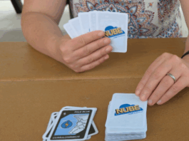 NASA’s NUBE Game Teaches Cloud Identification Through Play A person is shown with cards in their hand that say