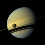 Key Facts About NASA Lewis’ Final Cassini Launch The yellowish-blue planet Saturn with its Titan moon in the foreground.