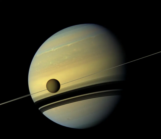 Key Facts About NASA Lewis’ Final Cassini Launch The yellowish-blue planet Saturn with its Titan moon in the foreground.