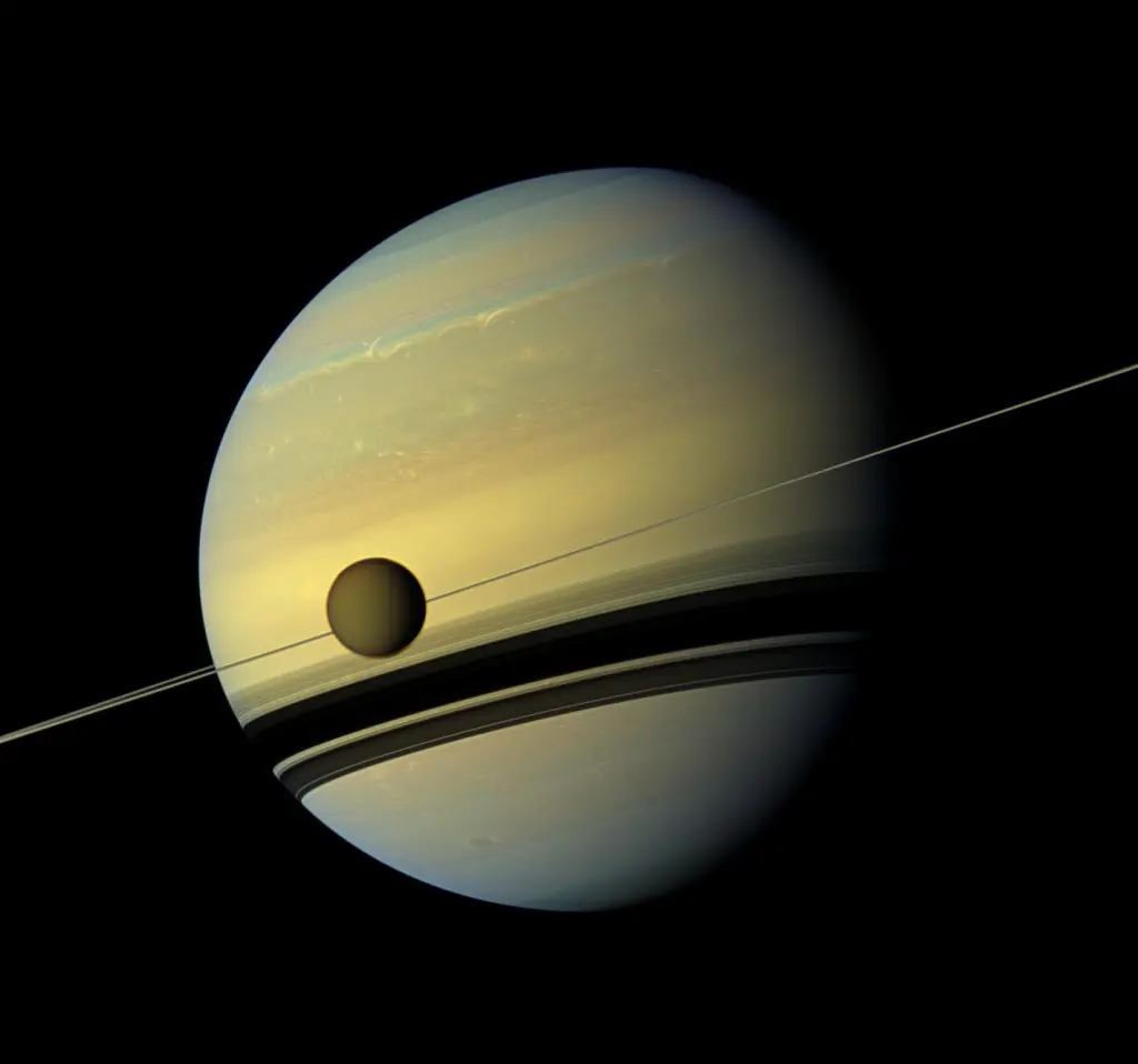 pia14922 1.png The yellowish-blue planet Saturn with its Titan moon in the foreground.