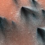 Mars’ Geyser Activity Observed by NASA Gas geysers on Mars blow out dark, triangle-shaped fans of dust and sand onto the red Martian surface.