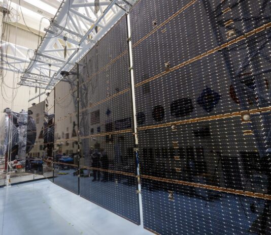 NASA Conducts Tests on Solar Arrays for Europa Clipper Mission Large black rectangular solar arrays stretch out from the foreground to the back.