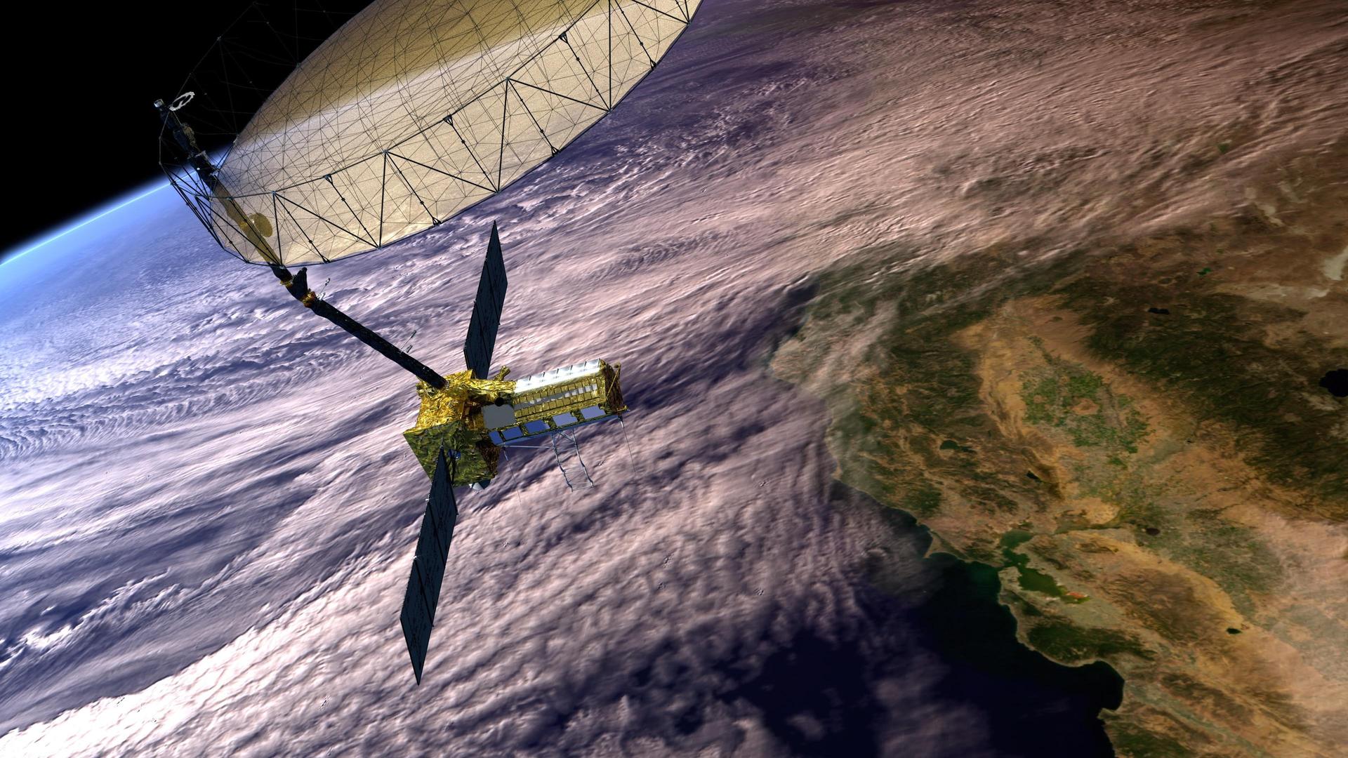 pia26285large1.jpg A satellite with gold metallic accents orbits the cloudy Earth.