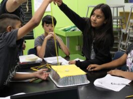 NASA Unveils Free PLANETS Resources for After-School Programs An out of school time educator holds a measuring tape as an elementary aged girl drops a weight to test the space craft shield her group created. Her group members, two boys and one girl, watch as she drops the weight.