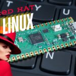 MacBook Pro Ubuntu Setup: Step-By-Step Instructions For Success keyboard with Red Hat Linux logo.