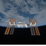 Understanding the International Space Station for Middle Schoolers Backdropped by the blackness of space and Earth